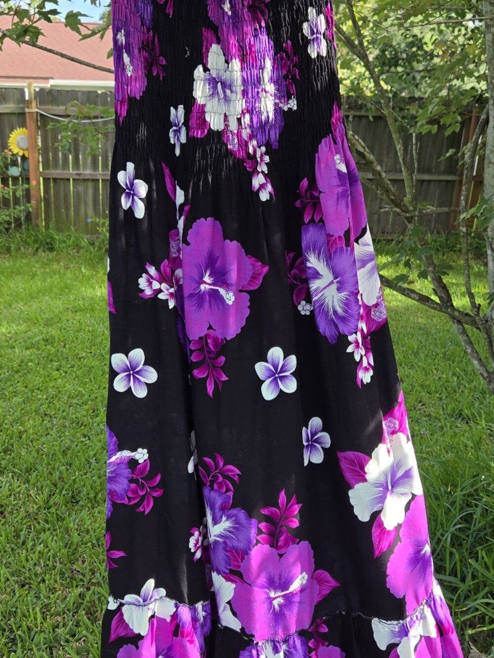 Strapless floral maxi dress in stunning colors.  Smocked top and flounced bottom